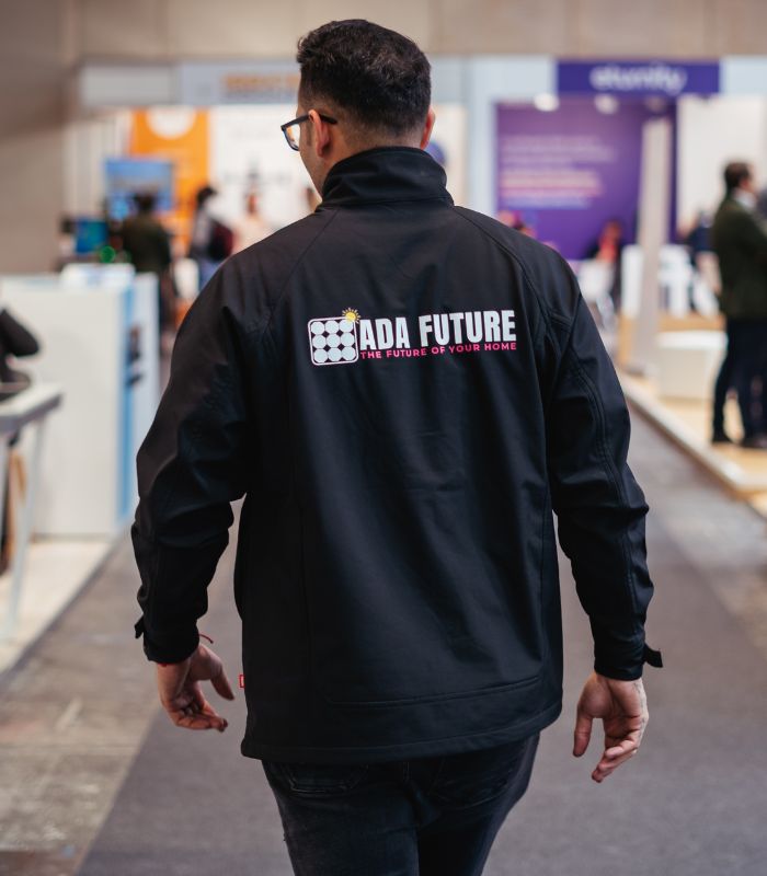 Man wearing ADA Future jacket at an indoor event
